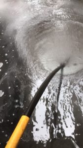 Dirty heating system being flushed